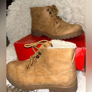 Used Timberland looking, fur inside boot. Material very soft